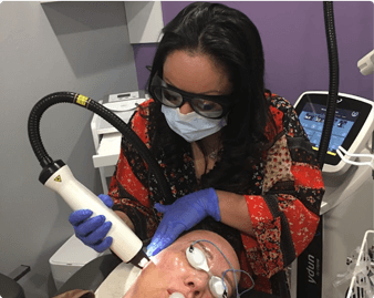 Dr. Lizbeth Guerrero performing facial procedure