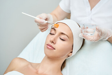 Woman undergoing chemical peels at Beauty and Health by Liz
